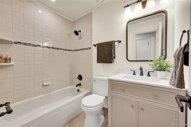 full bathroom with toilet, vanity, and tiled shower / bath