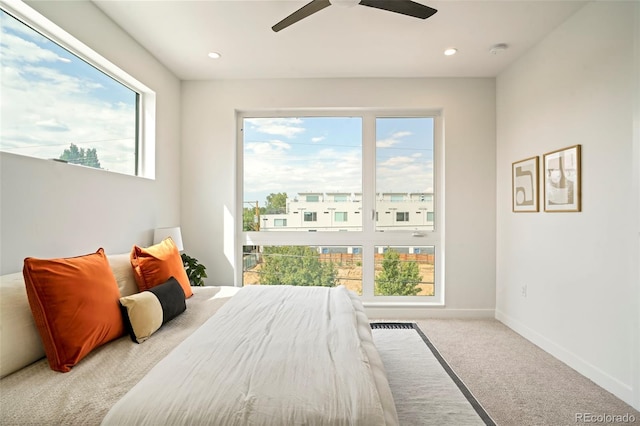 carpeted bedroom with ceiling fan