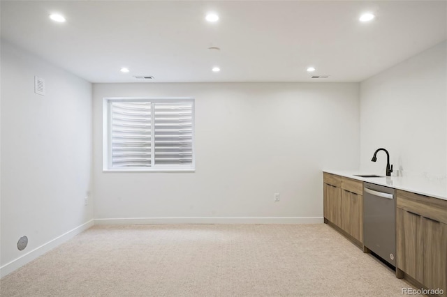 bar featuring light colored carpet, dishwasher, and sink