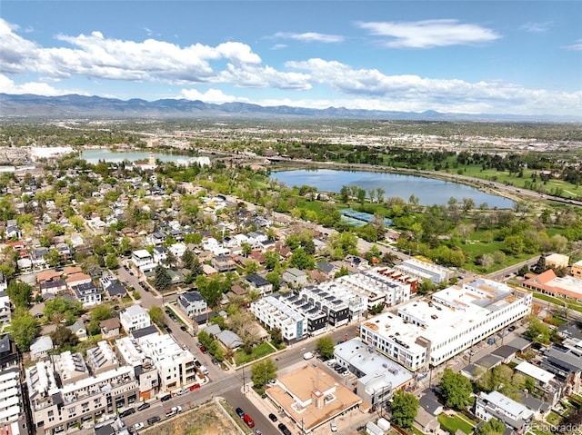 bird's eye view with a water and mountain view