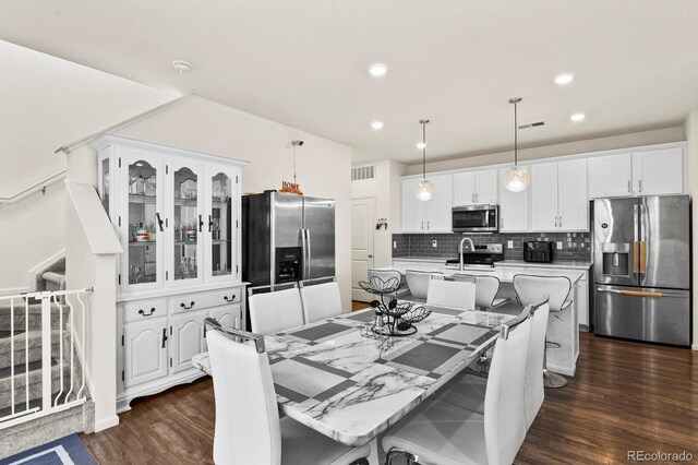 dining room with dark wood-type flooring