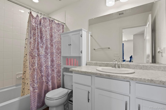 full bathroom featuring vanity, shower / bath combination with curtain, and toilet