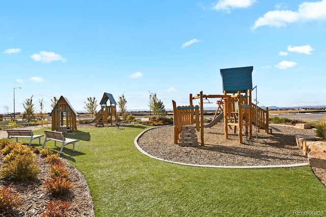 view of play area featuring a lawn