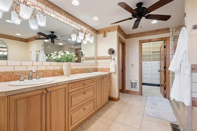 948 Manor Gate Pt, Colorado Springs, CO 80906 - full bath featuring a ceiling fan, tasteful backsplash, tile patterned floors, double vanity, and recessed lighting