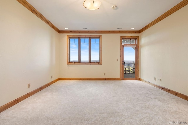 948 Manor Gate Pt, Colorado Springs, CO 80906 - spare room featuring ornamental molding, baseboards, plenty of natural light, carpet floors, and recessed lighting