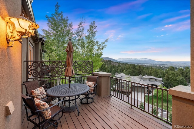 948 Manor Gate Pt, Colorado Springs, CO 80906 - wooden deck with a mountain view and outdoor dining area