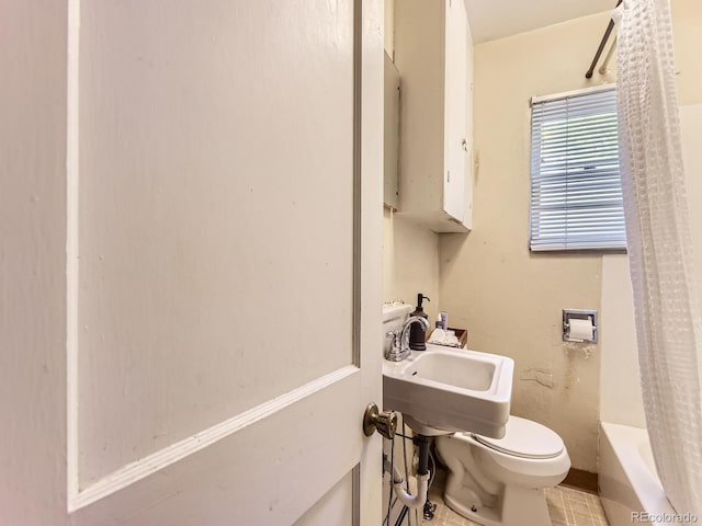 3265 S Ogden St, Englewood, CO 80113 - bathroom featuring toilet and shower / tub combo