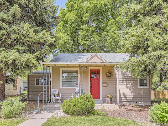3265 S Ogden St, Englewood, CO 80113 - bungalow-style house featuring roof with shingles and a porch