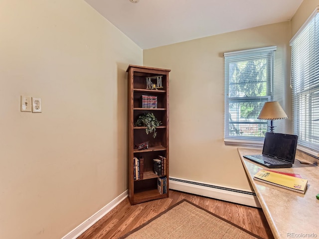 3265 S Ogden St, Englewood, CO 80113 - office area featuring a baseboard radiator, wood finished floors, healthy amount of natural light, and baseboards
