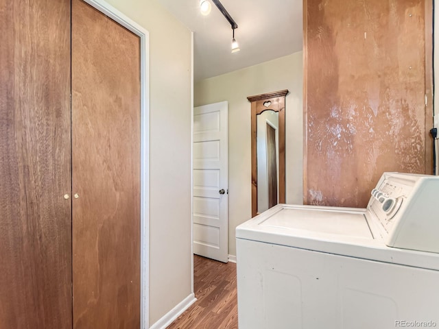 3265 S Ogden St, Englewood, CO 80113 - laundry area featuring washer and clothes dryer, wood finished floors, baseboards, and rail lighting