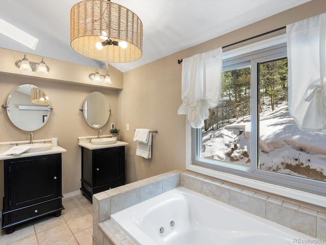 28268 Shadow Mountain Dr, Conifer, CO 80433 - full bath with two vanities, a tub with jets, and tile patterned flooring