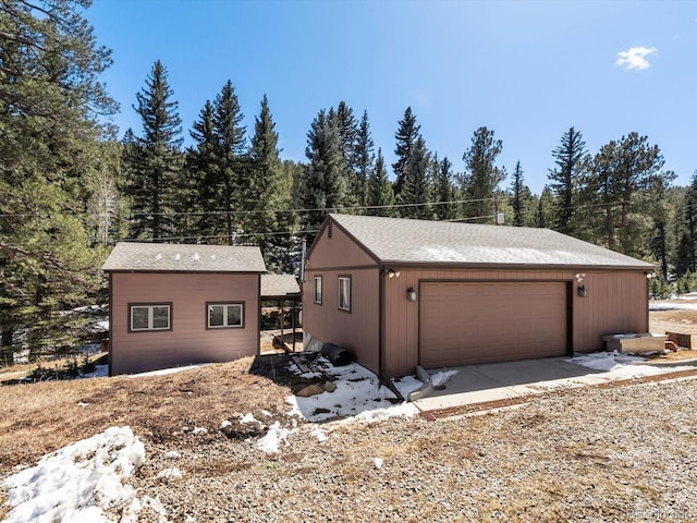 28268 Shadow Mountain Dr, Conifer, CO 80433 - detached garage featuring a forest view