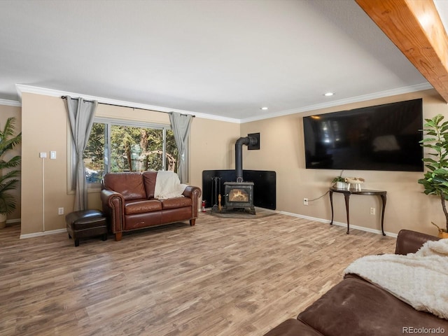 28268 Shadow Mountain Dr, Conifer, CO 80433 - living room featuring a wood stove, crown molding, wood finished floors, and recessed lighting