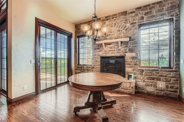 4725 Palmer Ridge Dr, Parker, CO 80134 - dining room with wood finished floors, healthy amount of natural light, and a chandelier