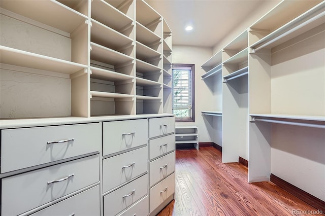 4725 Palmer Ridge Dr, Parker, CO 80134 - walk in closet featuring dark wood-style floors