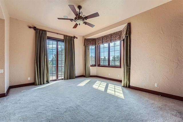 4725 Palmer Ridge Dr, Parker, CO 80134 - carpeted spare room with a textured wall and a ceiling fan