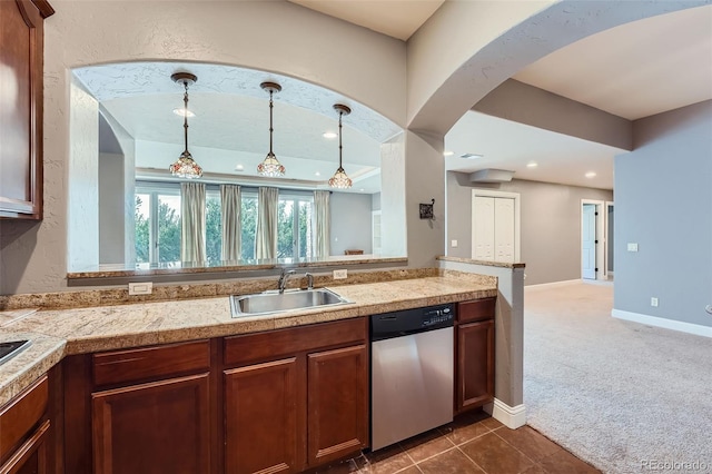 4725 Palmer Ridge Dr, Parker, CO 80134 - kitchen featuring stainless steel dishwasher, tile counters, pendant lighting, dark carpet, and arched walkways