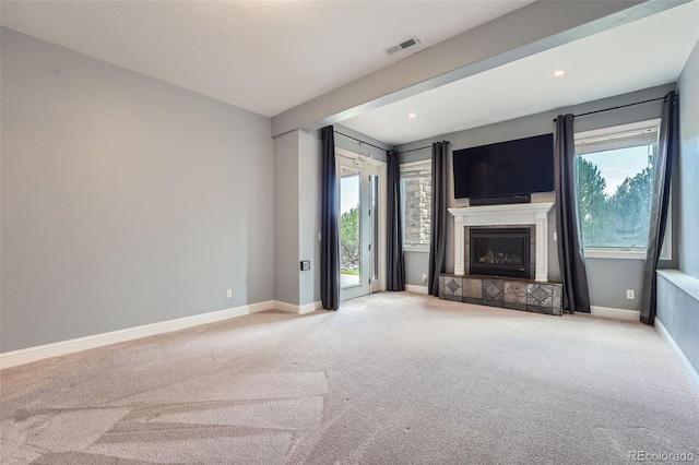 4725 Palmer Ridge Dr, Parker, CO 80134 - unfurnished living room with carpet, a tile fireplace, and recessed lighting