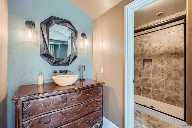 4725 Palmer Ridge Dr, Parker, CO 80134 - full bath with vanity, a stall shower, and a textured wall