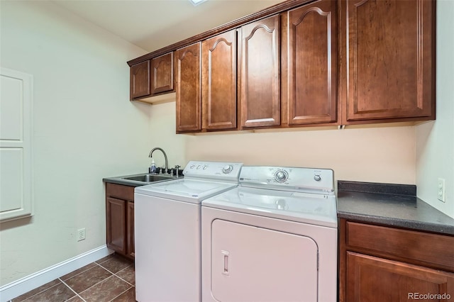 4725 Palmer Ridge Dr, Parker, CO 80134 - washroom featuring cabinet space, washer and dryer, and dark tile patterned floors