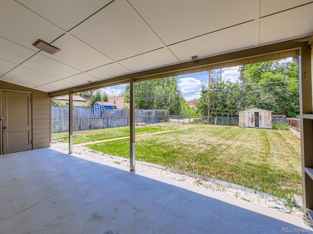 235 S Stuart St, Denver, CO 80219 - fenced backyard featuring a shed and a patio