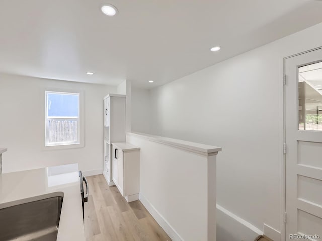 235 S Stuart St, Denver, CO 80219 - hall featuring light wood-type flooring, healthy amount of natural light, and recessed lighting