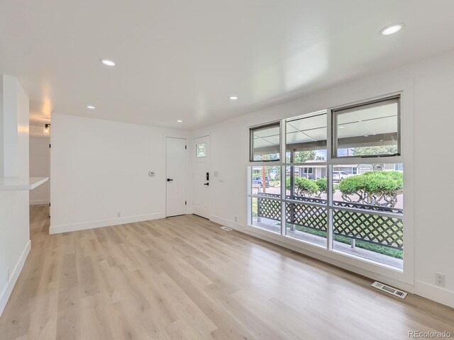 235 S Stuart St, Denver, CO 80219 - empty room with light wood-style floors and recessed lighting