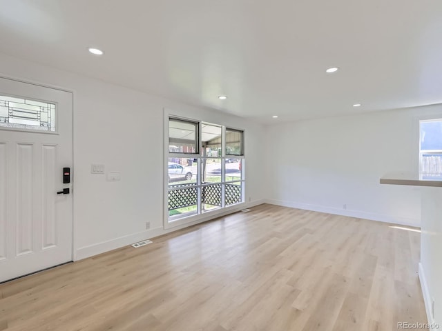 235 S Stuart St, Denver, CO 80219 - foyer featuring plenty of natural light, light wood-style floors, and recessed lighting