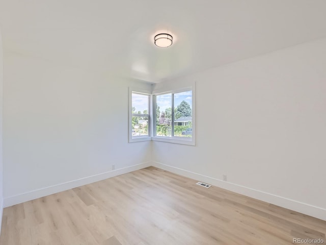 235 S Stuart St, Denver, CO 80219 - empty room with light wood-style floors