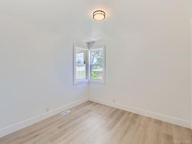 235 S Stuart St, Denver, CO 80219 - spare room with baseboards and light wood-style flooring