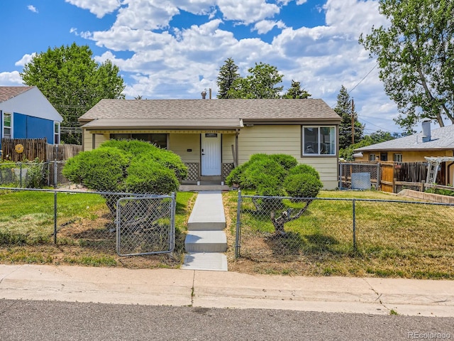 235 S Stuart St, Denver, CO 80219 - bungalow-style home with a fenced front yard, a gate, and roof with shingles