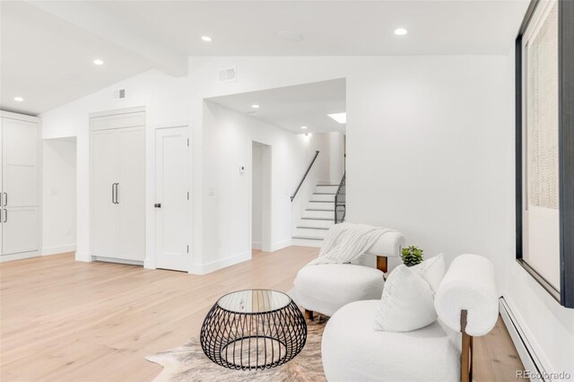 living area with vaulted ceiling with beams, stairs, light wood-style floors, a baseboard heating unit, and recessed lighting