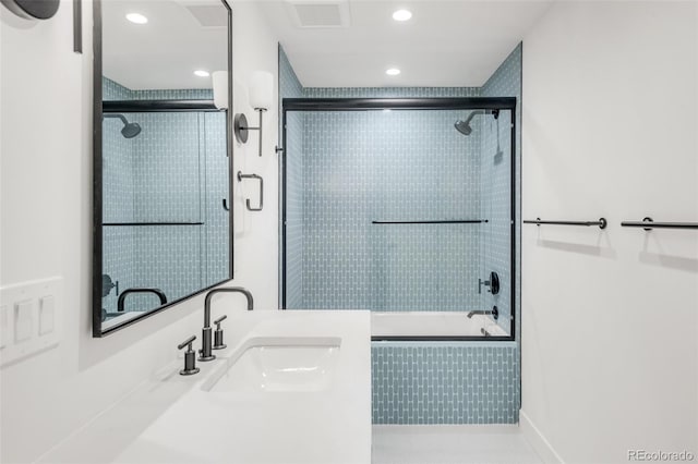 bathroom featuring recessed lighting, visible vents, enclosed tub / shower combo, vanity, and tile patterned flooring