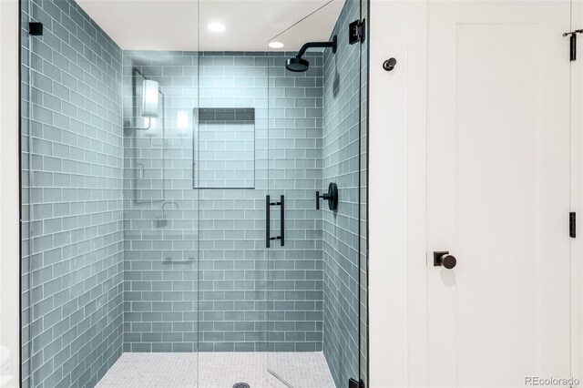 bathroom with a shower stall