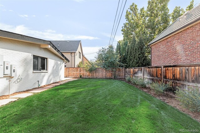 view of yard with a fenced backyard