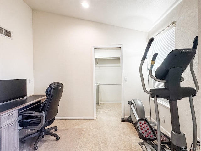 home office featuring visible vents, light colored carpet, baseboards, and lofted ceiling