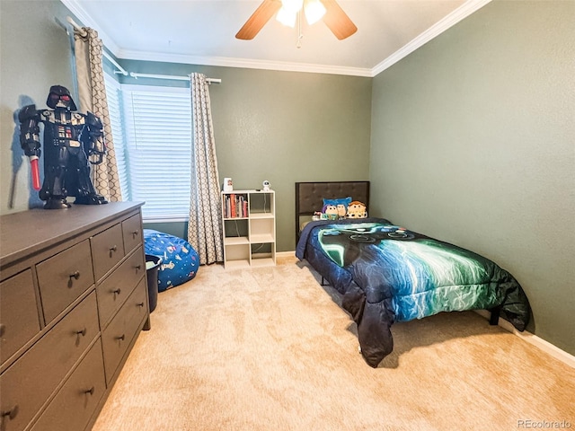 bedroom featuring light colored carpet, baseboards, ceiling fan, and ornamental molding