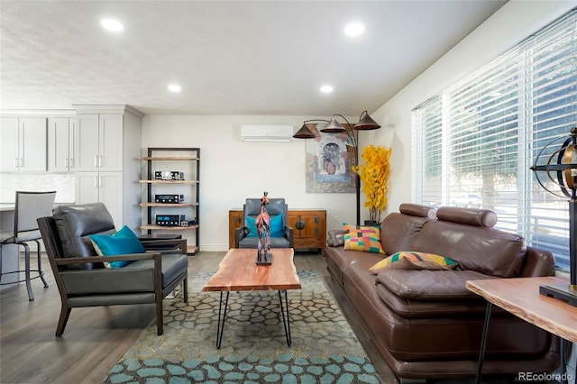 living area featuring recessed lighting, a wall mounted AC, and wood finished floors