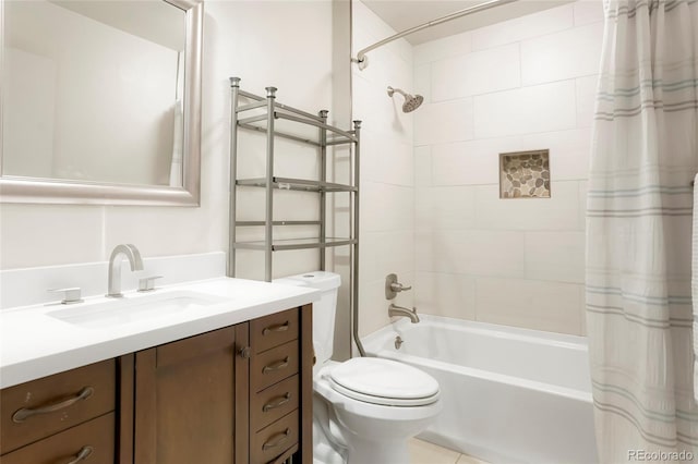 full bath with vanity, shower / tub combo, and toilet