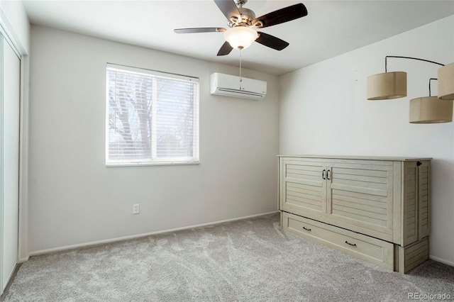 unfurnished room with ceiling fan, carpet flooring, and a wall unit AC