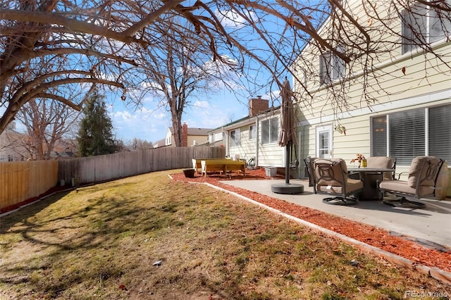 view of yard with a patio and a fenced backyard