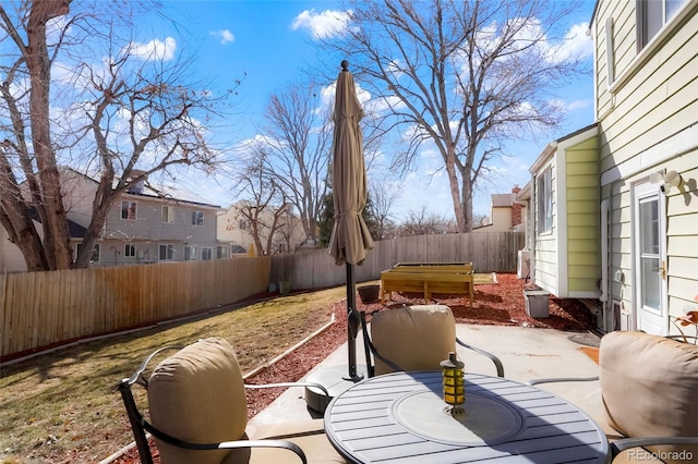 view of patio / terrace featuring outdoor dining space and a fenced backyard