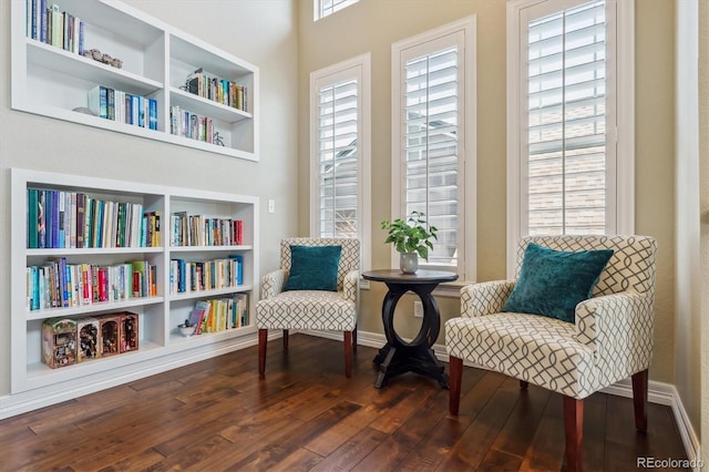 6927 Winter Ridge Pl, Castle Pines, CO 80108 - sitting room with baseboards, built in features, and wood-type flooring