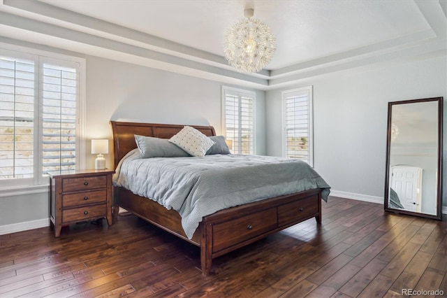 6927 Winter Ridge Pl, Castle Pines, CO 80108 - bedroom with baseboards, a raised ceiling, and dark wood finished floors