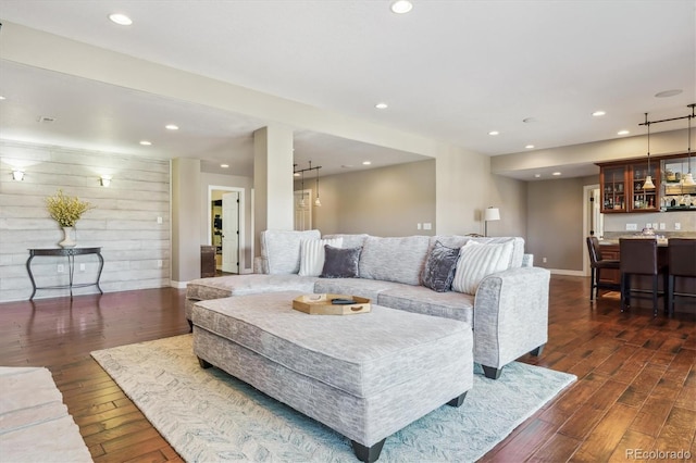 6927 Winter Ridge Pl, Castle Pines, CO 80108 - living room with recessed lighting, dark wood finished floors, indoor bar, and baseboards