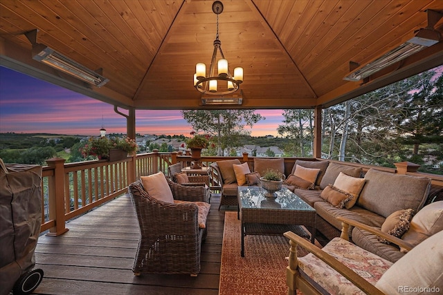 6927 Winter Ridge Pl, Castle Pines, CO 80108 - deck at dusk featuring a gazebo and an outdoor hangout area
