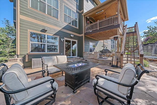 6927 Winter Ridge Pl, Castle Pines, CO 80108 - view of patio featuring a fire pit, a balcony, and stairs