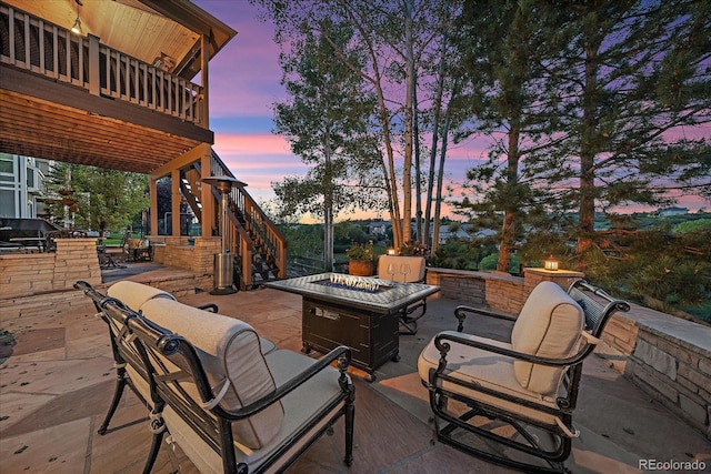 6927 Winter Ridge Pl, Castle Pines, CO 80108 - view of patio / terrace with a fire pit, stairs, and a deck
