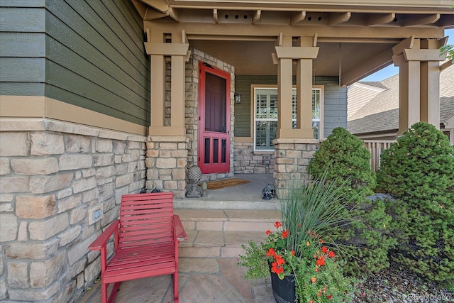 6927 Winter Ridge Pl, Castle Pines, CO 80108 - property entrance with a porch and stone siding