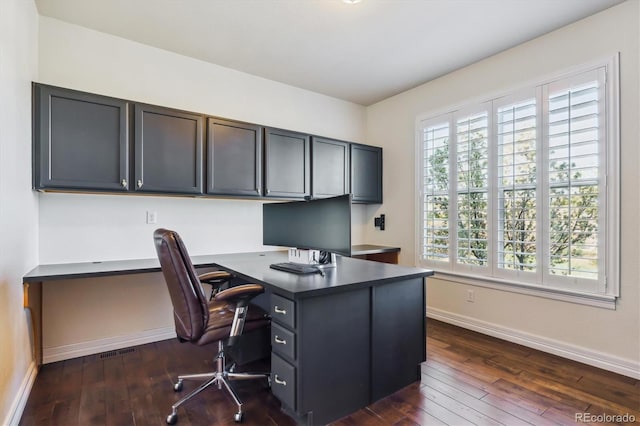 6927 Winter Ridge Pl, Castle Pines, CO 80108 - office featuring baseboards, built in desk, and dark wood finished floors